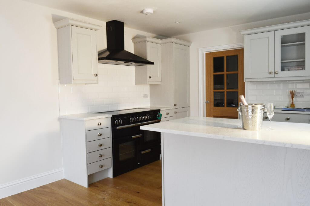 A view of a kitchen that has been recently furnished