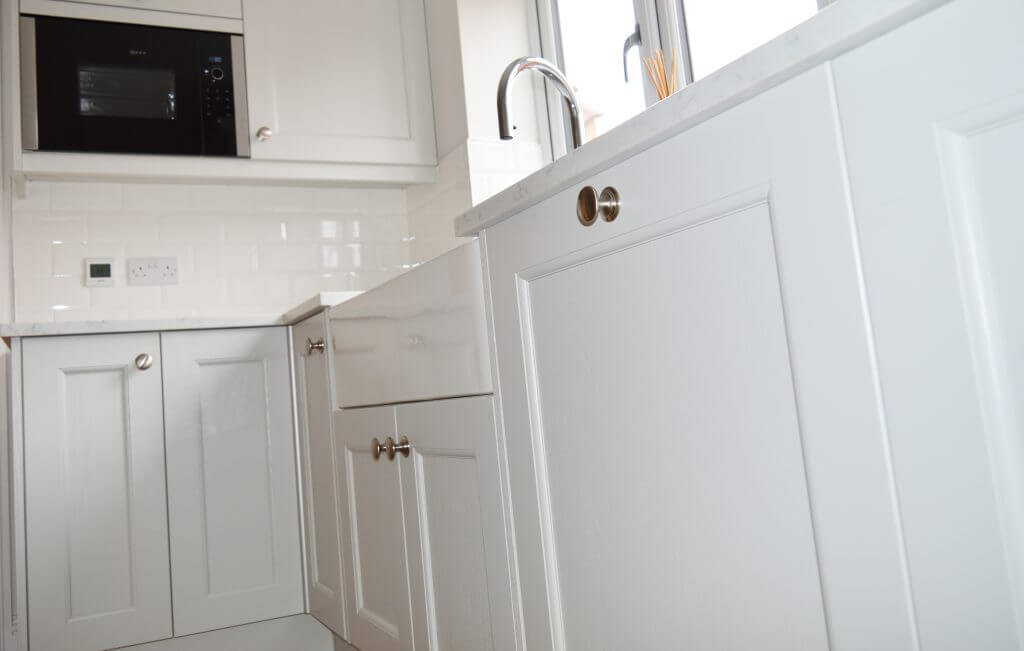 A sink and cupboards fitted in a kitchen